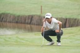 Hanzhe Zhou First Team Junior All-Asia Reading his putt at The Southern Junior