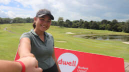 Camille Boyd, top-ranked player on the Junior Order of Merit Rankings 2017-2018, posing in front of dwell Student Living signage at Bintan Lagoon Resort