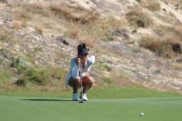 Yu Wen Lu reading her putt at the JGTA Junior Aspirations at The Bluffs, one of the many players from the JGTA leading the charge in the fight against Covid-19